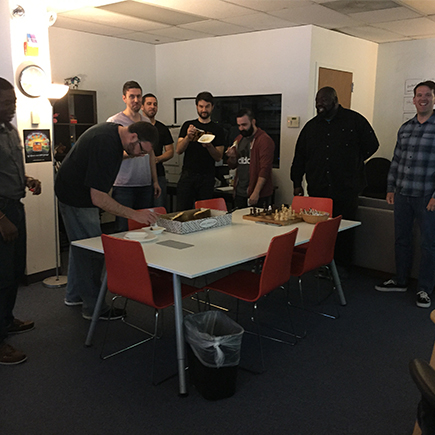 A lot of nervous looks as the group prepares to eat a slice of Durian.